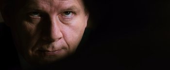 Movie still from “The Bourne Ultimatum” (2007), directed by Paul Greengrass – A man's face in the dark; Extreme Close Up shot, Low angle