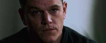 Movie still from “The Bourne Ultimatum” (2007), directed by Paul Greengrass – A man's face with blue eyes; Close Up shot, Low angle