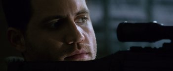 Movie still from “The Bourne Ultimatum” (2007), directed by Paul Greengrass – A man's face as he looks into the distance; Close Up shot, Over the shoulder angle