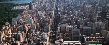 Movie still from “The Bourne Ultimatum” (2007), directed by Paul Greengrass – An aerial view of a large city with many buildings; Extreme Wide shot, Overhead angle