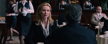 Movie still from “The Bourne Ultimatum” (2007), directed by Paul Greengrass – A woman sitting at a table talking to a man; Medium shot, Over the shoulder angle