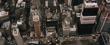 Movie still from “The Bourne Ultimatum” (2007), directed by Paul Greengrass – An aerial view of a busy city street; Extreme Wide shot, Overhead angle