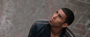 Movie still from “The Bourne Ultimatum” (2007), directed by Paul Greengrass – A person wearing a leather jacket looking up; Close Up shot, Low angle