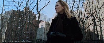 Movie still from “The Bourne Ultimatum” (2007), directed by Paul Greengrass – A woman in a black coat and a black scarf; Medium shot, Low angle