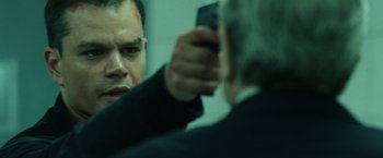 Movie still from “The Bourne Ultimatum” (2007), directed by Paul Greengrass – A man taking a picture of himself in the mirror; Close Up shot, Over the shoulder angle