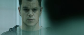 Movie still from “The Bourne Ultimatum” (2007), directed by Paul Greengrass – A man's face in front of a window; Close Up shot, Low angle