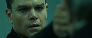 Movie still from “The Bourne Ultimatum” (2007), directed by Paul Greengrass – A man's face with blood on his face; Close Up shot, Low angle