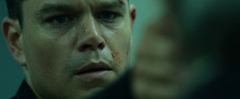 Movie still from “The Bourne Ultimatum” (2007), directed by Paul Greengrass – A man's face with blood all over his face; Close Up shot, Low angle