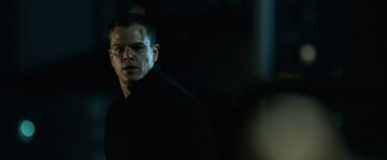 Movie still from “The Bourne Ultimatum” (2007), directed by Paul Greengrass – A person wearing a black jacket; Close Up shot, Low angle