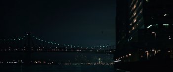Movie still from “The Bourne Ultimatum” (2007), directed by Paul Greengrass – A view of a bridge lit up at night; Extreme Wide shot, High angle