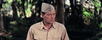 Movie still from “The Bridge on the River Kwai” (1957), directed by David Lean – A person wearing a hat; Close Up shot, Low angle