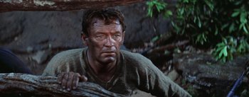 Movie still from “The Bridge on the River Kwai” (1957), directed by David Lean – A person wearing a shirt; Close Up shot, Low angle