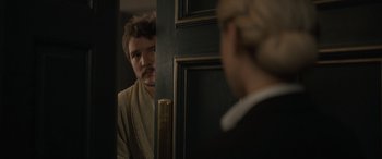 Movie still from “The Bubble” (2022), directed by Judd Apatow – A man standing in front of a mirror looking at a woman; Close Up shot, Over the shoulder angle