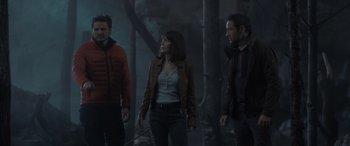 Movie still from “The Bubble” (2022), directed by Judd Apatow – A group of people standing in the woods; Medium shot, Low angle
