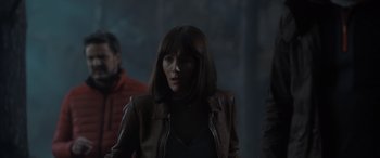 Movie still from “The Bubble” (2022), directed by Judd Apatow – A woman in a brown jacket standing next to another woman; Medium shot, Over the shoulder angle