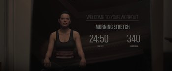 Movie still from “The Bubble” (2022), directed by Judd Apatow – A woman is standing in front of a screen; Extreme Close Up shot, Over the shoulder angle