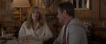 Movie still from “The Bubble” (2022), directed by Judd Apatow – A man and a woman are sitting at a table; Medium shot, Over the shoulder angle