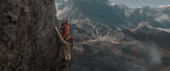 Movie still from “The Bubble” (2022), directed by Judd Apatow – A woman and a child climbing a rock wall; Extreme Wide shot, Low angle