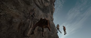 Movie still from “The Bubble” (2022), directed by Judd Apatow – A group of people climbing up a rock wall; Wide shot, Overhead angle