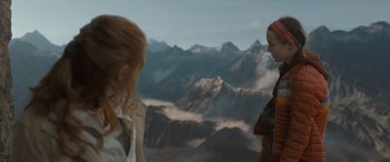 Movie still from “The Bubble” (2022), directed by Judd Apatow – Two people standing in front of a view of mountains; Wide shot, Over the shoulder angle