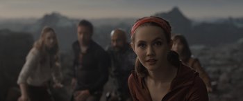 Movie still from “The Bubble” (2022), directed by Judd Apatow – A woman in a red headband and two other people in the background; Close Up shot, Over the shoulder angle