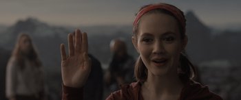 Movie still from “The Bubble” (2022), directed by Judd Apatow – A young woman is waving at the camera; Close Up shot, Over the shoulder angle