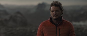 Movie still from “The Bubble” (2022), directed by Judd Apatow – A person wearing a red jacket; Close Up shot, Over the shoulder angle