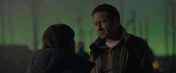 Movie still from “The Bubble” (2022), directed by Judd Apatow – A man and a woman talking to each other; Close Up shot, Over the shoulder angle