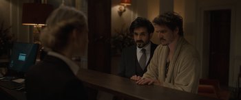 Movie still from “The Bubble” (2022), directed by Judd Apatow – A man and a woman sitting at a counter; Medium shot, Over the shoulder angle