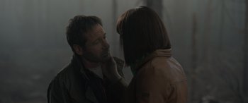 Movie still from “The Bubble” (2022), directed by Judd Apatow – A man and a woman looking at one another; Close Up shot, Over the shoulder angle