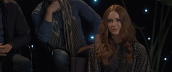 Movie still from “The Bubble” (2022), directed by Judd Apatow – A woman sitting next to a man in a room; Close Up shot, Over the shoulder angle