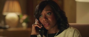 Movie still from “The Burial” (2023), directed by Maggie Betts – A woman talking on the phone; Close Up shot, Over the shoulder angle