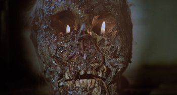 Movie still from “The Burning” (1981), directed by Tony Maylam – The face of an undead creature; Extreme Close Up shot, High angle