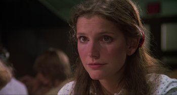 Movie still from “The Burning” (1981), directed by Tony Maylam – A person with long brown hair; Close Up shot, Low angle