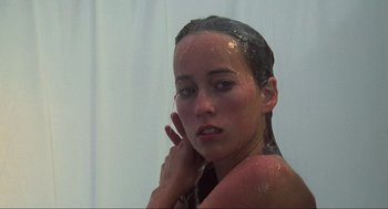Movie still from “The Burning” (1981), directed by Tony Maylam – A woman taking a shower in a bathroom; Close Up shot, Low angle