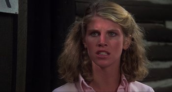 Movie still from “The Burning” (1981), directed by Tony Maylam – A person wearing a pink shirt; Close Up shot, Low angle