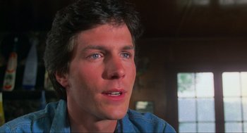 Movie still from “The Burning” (1981), directed by Tony Maylam – A person wearing a blue shirt; Close Up shot, Over the shoulder angle