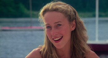 Movie still from “The Burning” (1981), directed by Tony Maylam – A beautiful young lady smiling for the camera; Close Up shot, Low angle