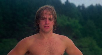 Movie still from “The Burning” (1981), directed by Tony Maylam – A shirtless man with wet hair and no shirt; Close Up shot, Low angle