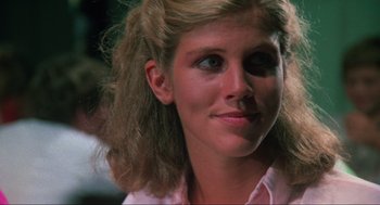 Movie still from “The Burning” (1981), directed by Tony Maylam – A person wearing a pink shirt; Close Up shot, Over the shoulder angle