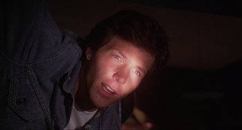 Movie still from “The Burning” (1981), directed by Tony Maylam – A man's face in the dark; Close Up shot, Low angle