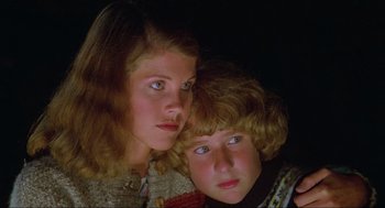 Movie still from “The Burning” (1981), directed by Tony Maylam – Two young children are posing for a picture; Close Up shot, Low angle