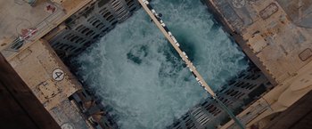 Movie still from “The Burning Sea” (2021), directed by John Andreas Andersen – An aerial view of a body of water; Extreme Wide shot, Overhead angle