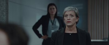 Movie still from “The Burning Sea” (2021), directed by John Andreas Andersen – Two women standing in front of each other in a room; Close Up shot, Low angle