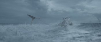 Movie still from “The Burning Sea” (2021), directed by John Andreas Andersen – A boat is in the water in the middle of the ocean; Extreme Wide shot, High angle
