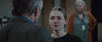 Movie still from “The Burning Sea” (2021), directed by John Andreas Andersen – A young woman is crying in front of an older man; Close Up shot, Over the shoulder angle