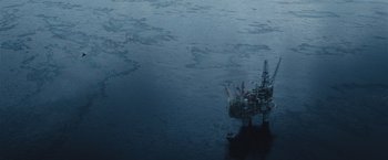 Movie still from “The Burning Sea” (2021), directed by John Andreas Andersen – An oil rig in the middle of the ocean; Extreme Wide shot, High angle