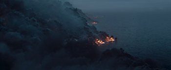 Movie still from “The Burning Sea” (2021), directed by John Andreas Andersen – An aerial view of a fire on the ocean; Extreme Wide shot, High angle