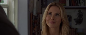 Movie still from “The Cabin in the Woods” (2011), directed by Drew Goddard – A beautiful blonde woman with blue eyes looking at the camera; Close Up shot, Over the shoulder angle