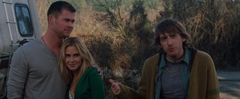 Movie still from “The Cabin in the Woods” (2011), directed by Drew Goddard – A group of people standing next to each other in a forest; Medium shot, Over the shoulder angle